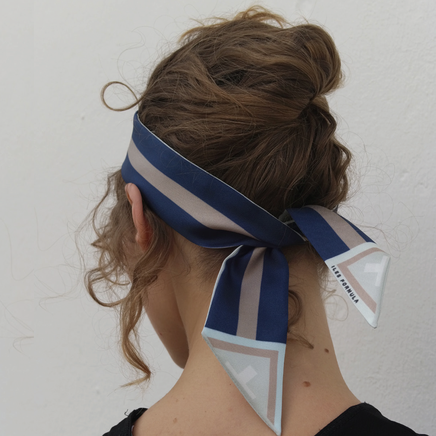 Model with an Up-Do Wearing A Twilly Hair Tie As A Headband