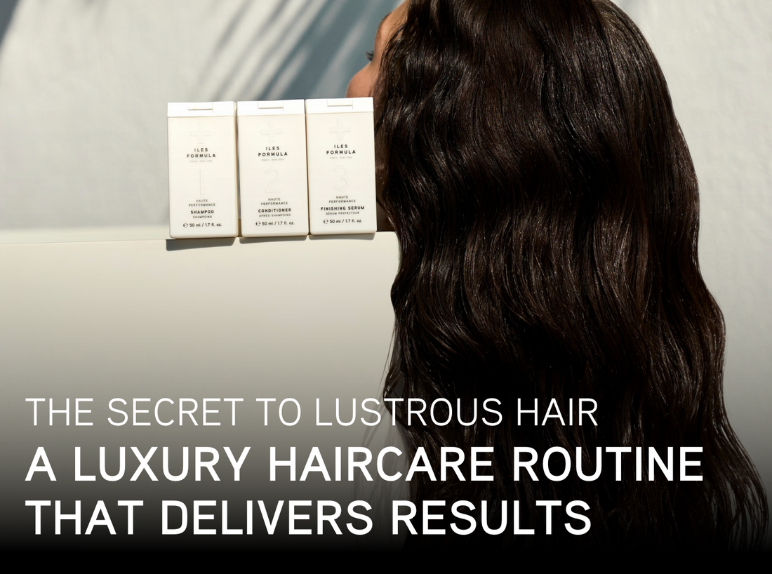 Person with long, shiny dark hair facing a shelf with three Iles Formula products, with text overlay that reads: “The secret to lustrous hair — A luxury haircare routine that delivers results.”