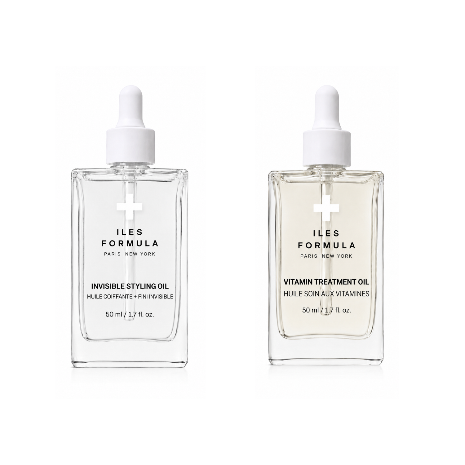 Two clear glass dropper bottles of Iles Formula Paris New York skincare oil on a white background. The left bottle is Invisible Styling Oil, and the right bottle is Vitamin Treatment Oil.