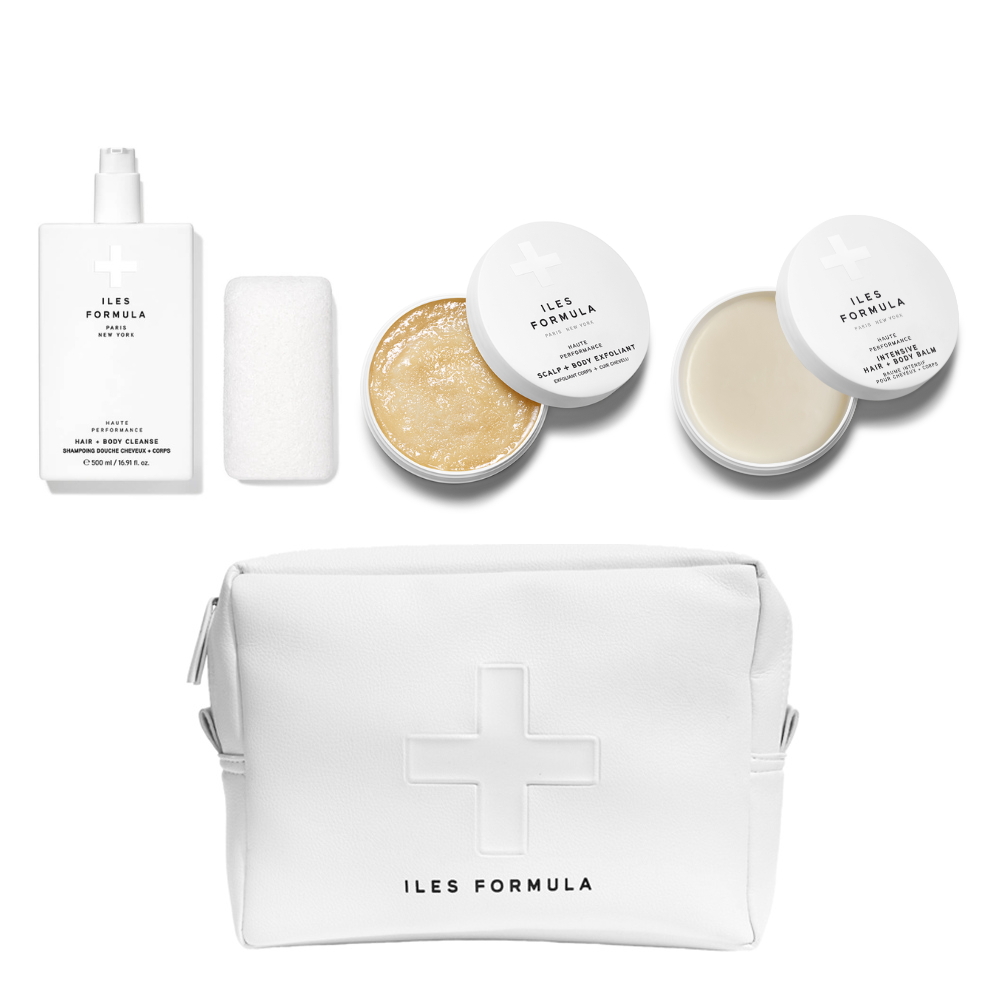 Cosmetic set with various products and a white pouch on a white background, featuring 'ILES FORMULA'.