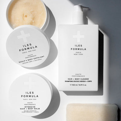 Spa Collection Flat Lay; Scalp + Body Exfoliant, Intensive Hair + Body Balm, Hair + Body Cleanser, and Body Sponge