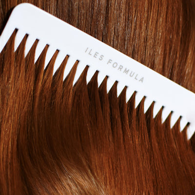 Conditioner Distribution Comb Brushing Through Red Hair